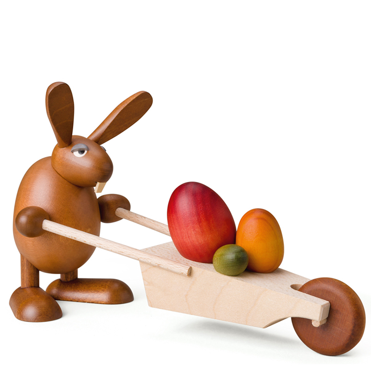 Osterhase mit Schubkarre und Ostereiern