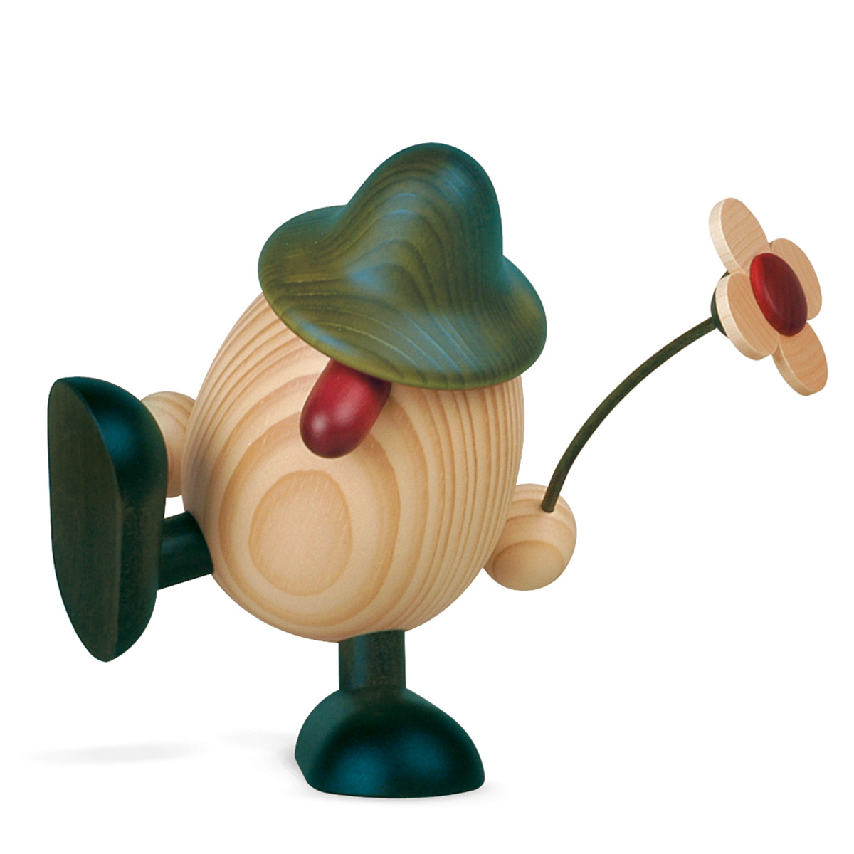Eierkopf Vater Alfons mit Blume auf Kante sitzend/tanzend, grün