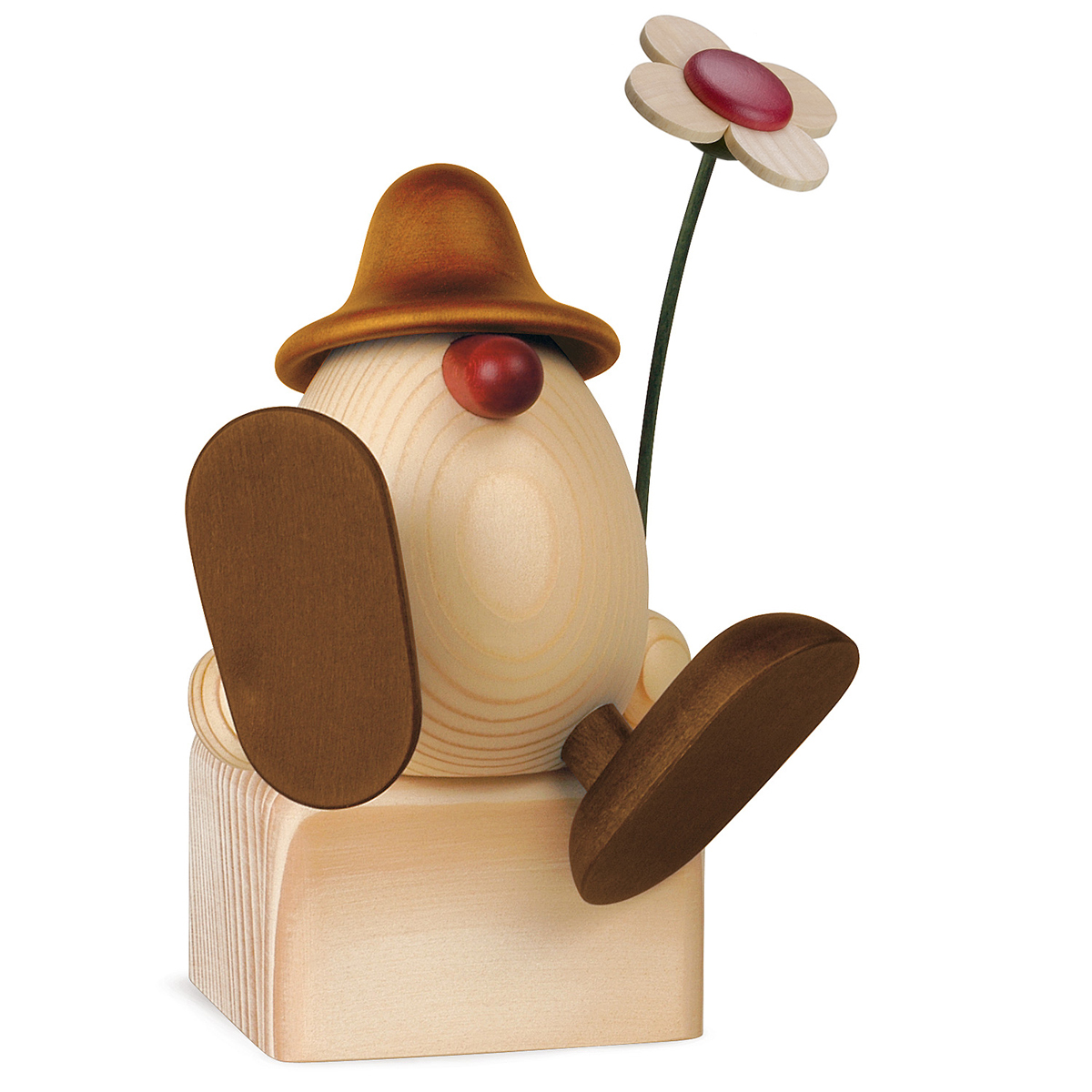 Eierkopf Alfons mit Blume auf Kante sitzend/tanzend, braun (ohne Klotz)