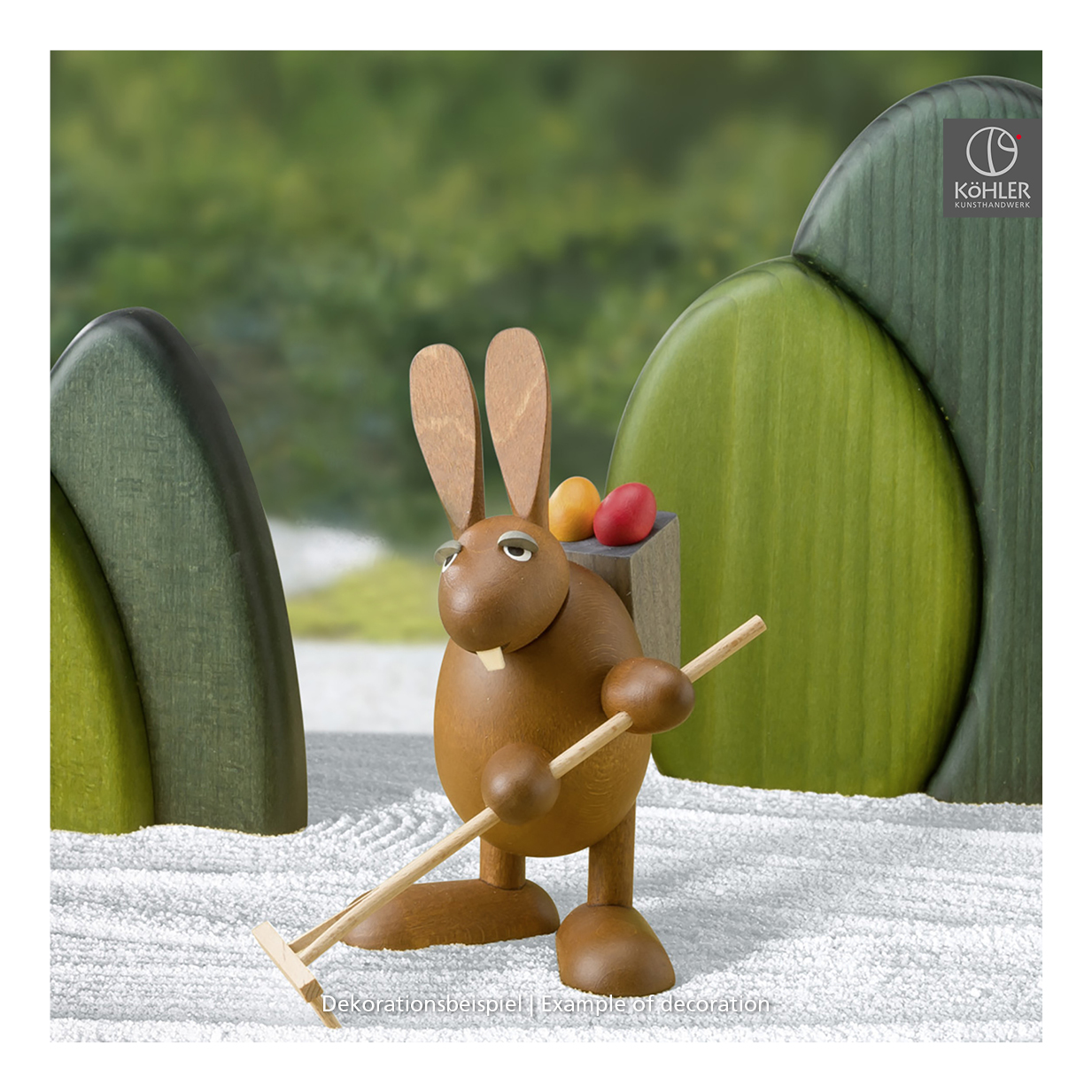 Easter Bunny with garden rake an easter grass