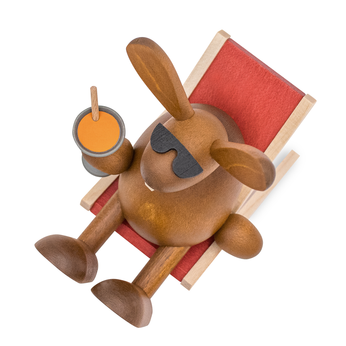 Easter bunny with carrot juice on the sun lounger