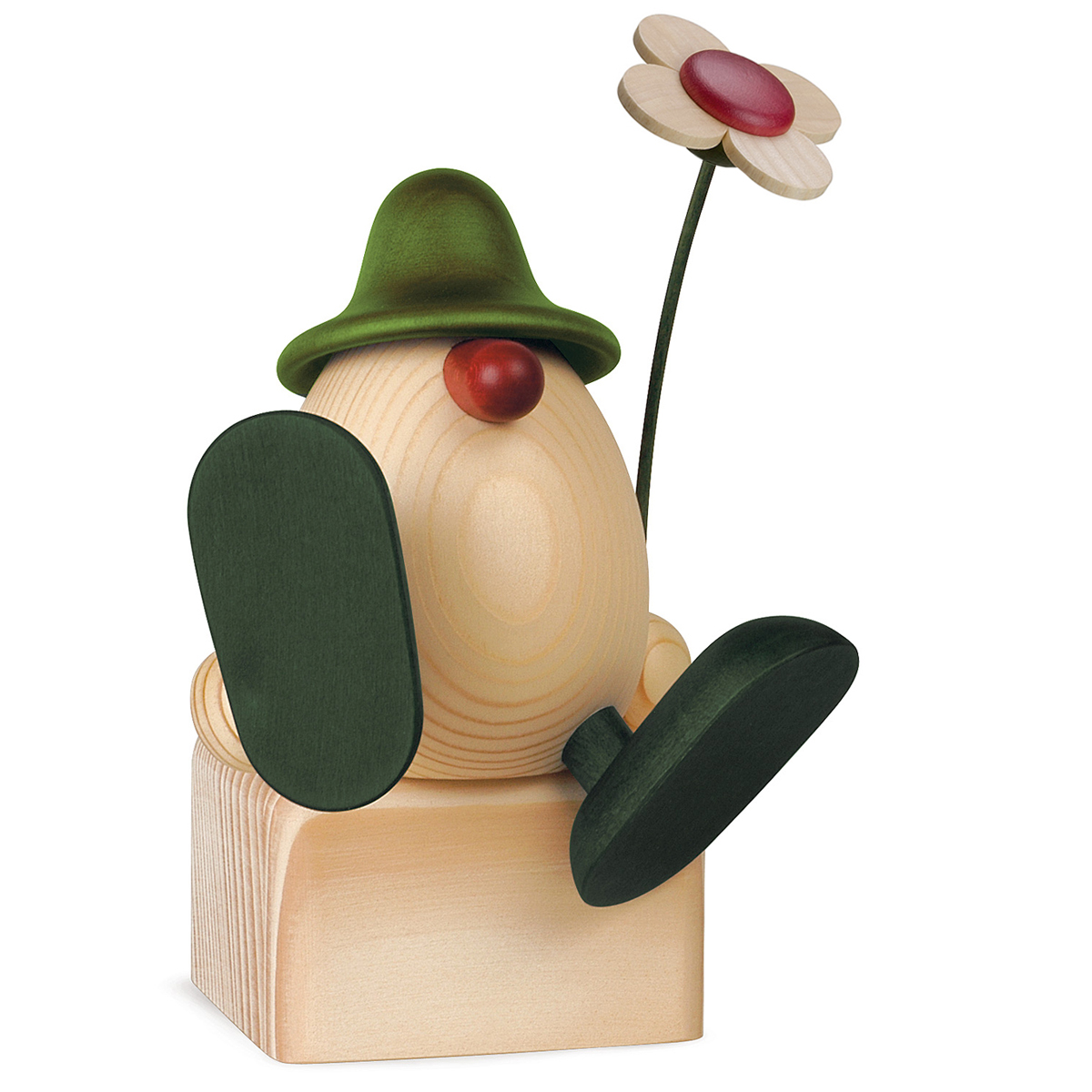 Eierkopf Alfons mit Blume auf Kante sitzend/tanzend, grün (ohne Klotz)